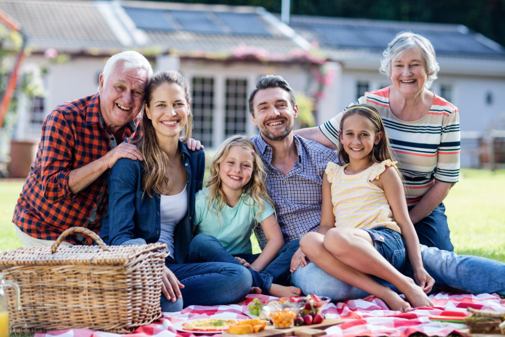 Happy family having a picnic in the garden