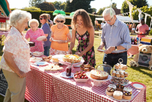 Busy,Cake,Stall,At,Summer,Garden,Fete
