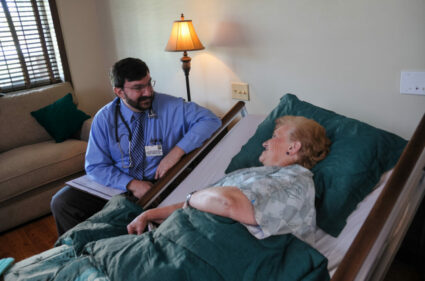 doctor speaks with patient about hospice vs palliative care