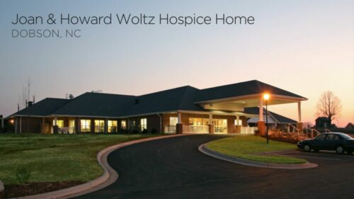 exterior of a hospice home at night