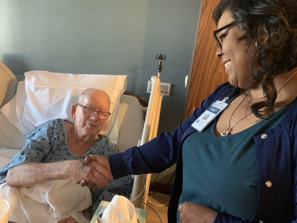 Here, National Guard Veteran Dorman Ward is honored with a challenge coin presentation in one of the Mountain Valley care centers.